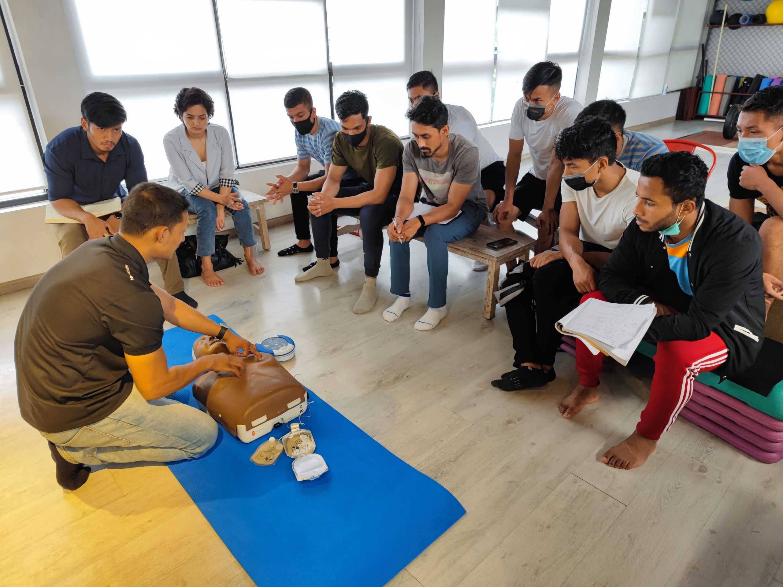 NYFA Nepal CPT students practicing life-saving CPR techniques during emergency first aid training at Tapout Fitness, Baluwatar.